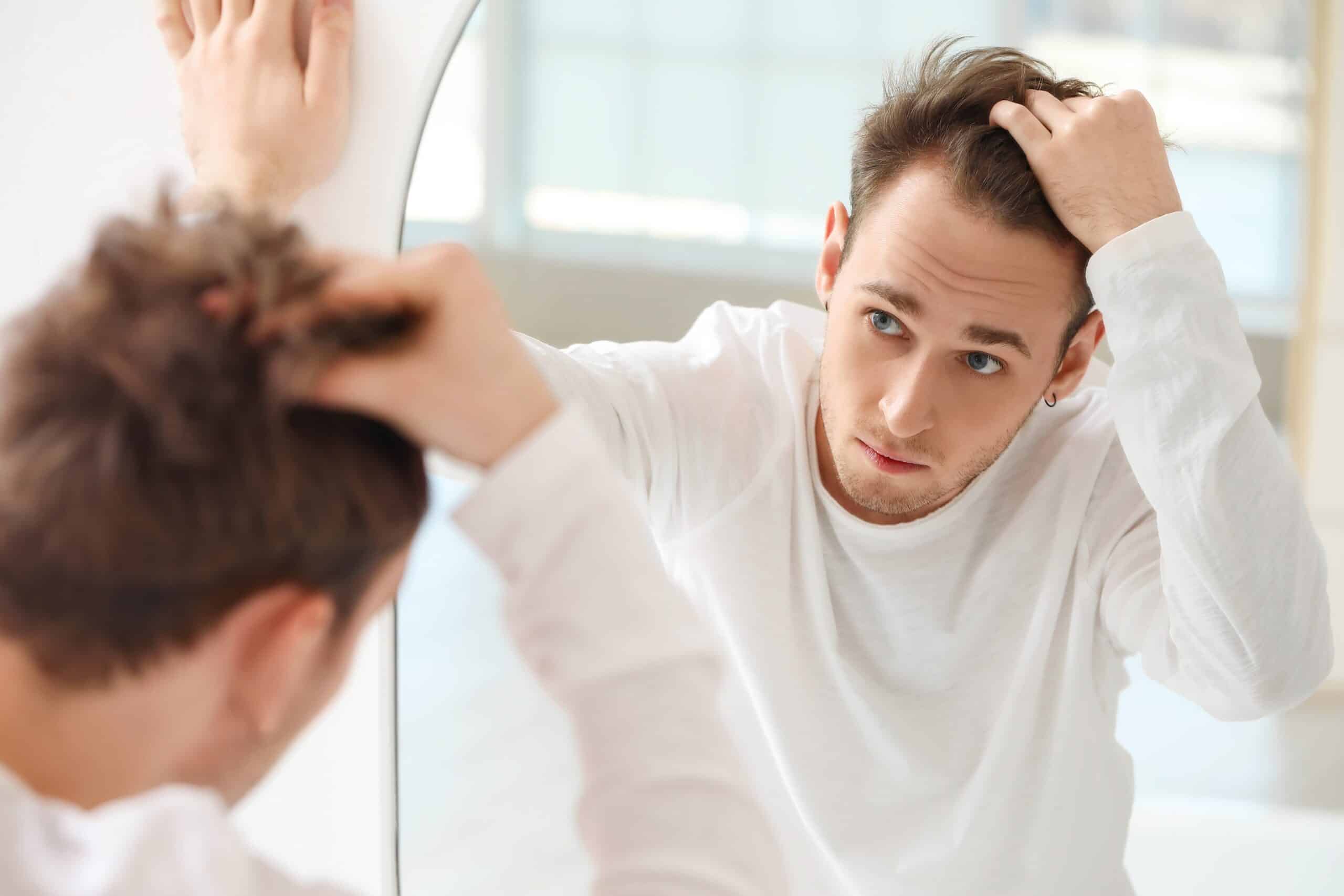 Hair transplants liverpool model looking in mirror